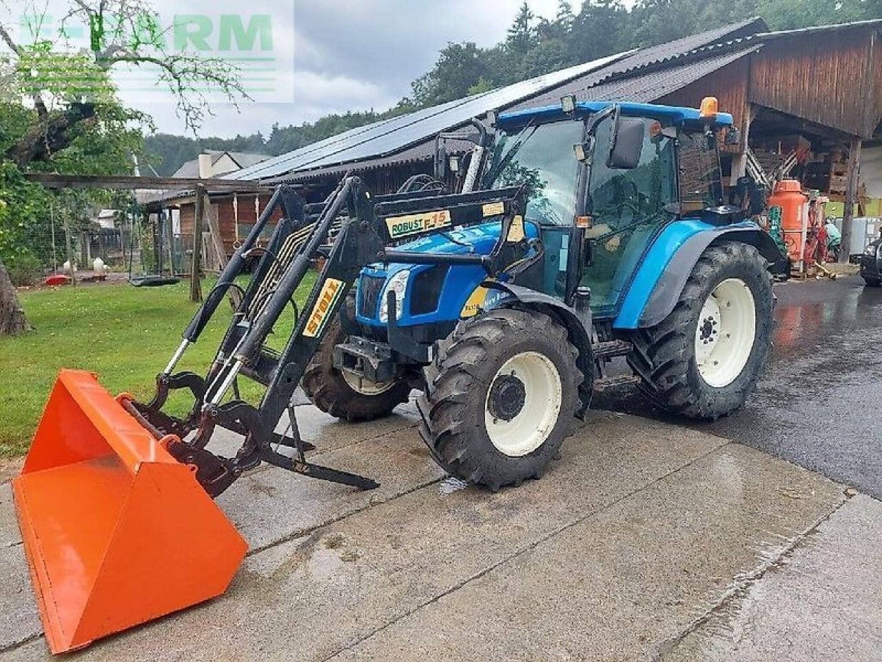 New Holland tl 90 a A - Traktör: fotoğraf 1 New Holland tl 90 a A - Traktör: fotoğraf 1