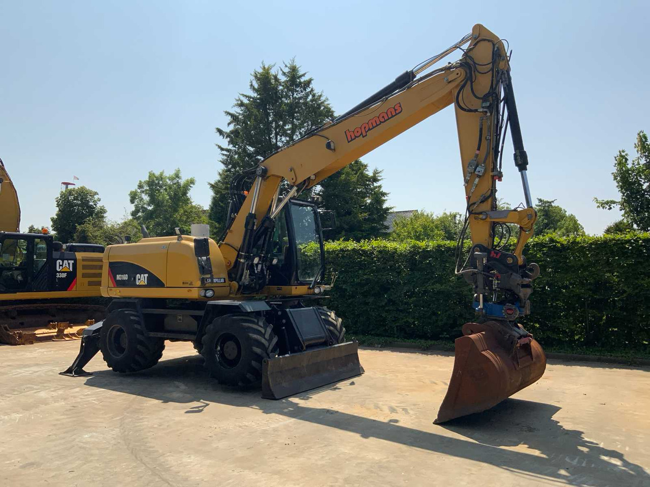 Caterpillar M316D - Tekerlekli ekskavatör: fotoğraf 2 Caterpillar M316D - Tekerlekli ekskavatör: fotoğraf 2