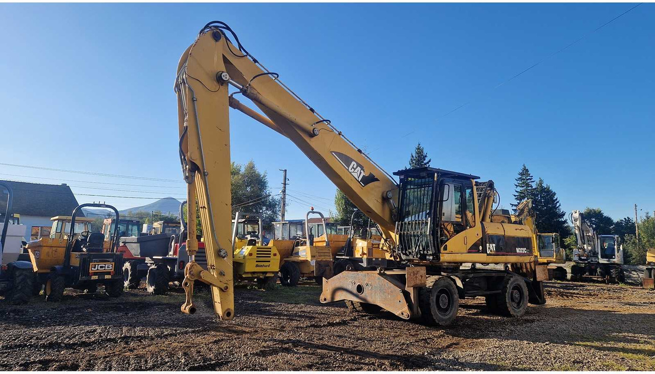 Caterpillar M322C - Tekerlekli ekskavatör: fotoğraf 1 Caterpillar M322C - Tekerlekli ekskavatör: fotoğraf 1