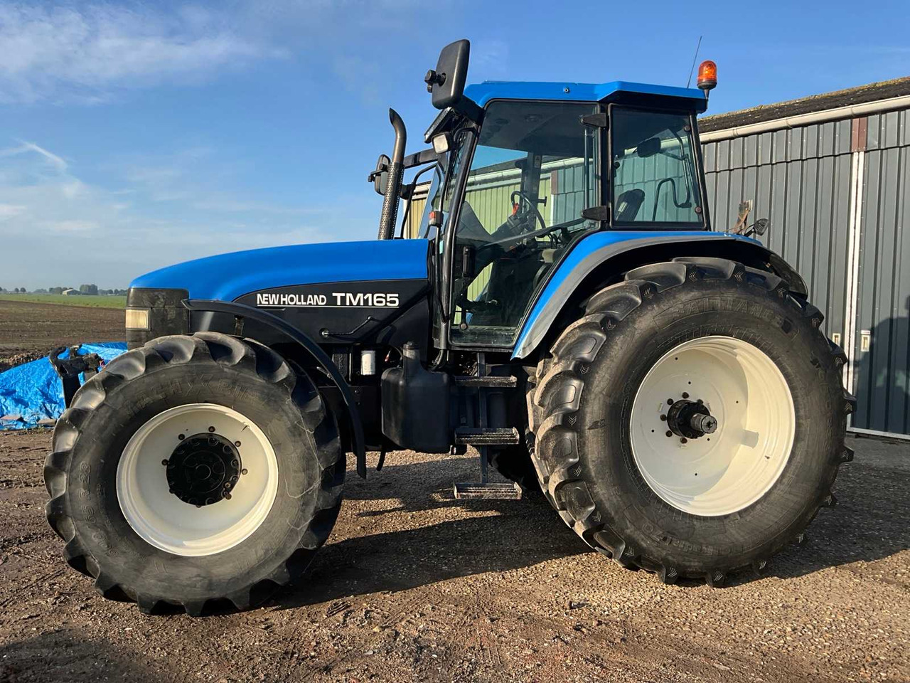 New Holland TM165 - Traktör: fotoğraf 5 New Holland TM165 - Traktör: fotoğraf 5