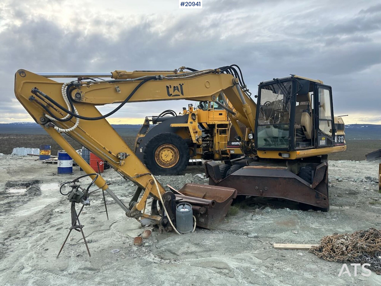 Caterpillar 312 - Tekerlekli ekskavatör: fotoğraf 1 Caterpillar 312 - Tekerlekli ekskavatör: fotoğraf 1