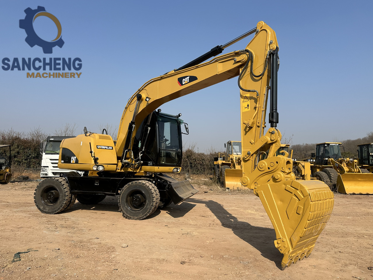 CATERPILLAR M320D2 - Tekerlekli ekskavatör: fotoğraf 1 CATERPILLAR M320D2 - Tekerlekli ekskavatör: fotoğraf 1