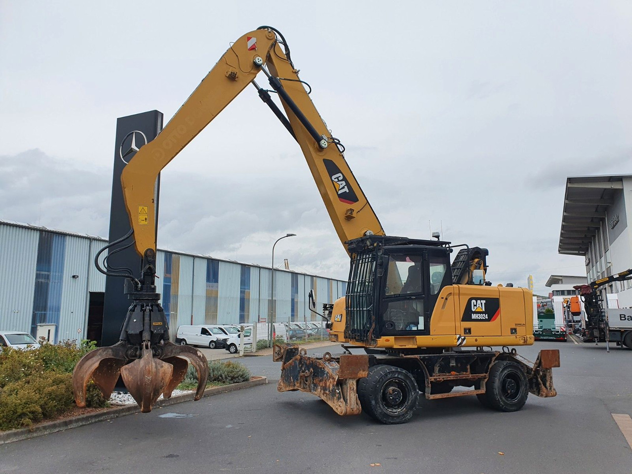 CAT MH3024 / MH 3024 / Greifer / 2018 / 9.424h - Tekerlekli ekskavatör: fotoğraf 2 CAT MH3024 / MH 3024 / Greifer / 2018 / 9.424h - Tekerlekli ekskavatör: fotoğraf 2