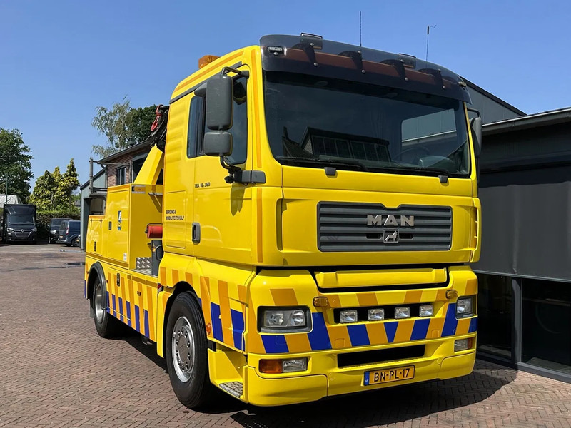MAN TGA 18.360 Takelwagen Palfinger Kraan Falkom Brill - Çekici kamyonu: fotoğraf 1 MAN TGA 18.360 Takelwagen Palfinger Kraan Falkom Brill - Çekici kamyonu: fotoğraf 1