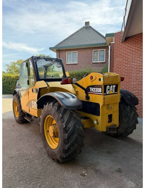 Caterpillar TH330B - Teleskopik yükleyici: fotoğraf 5 Caterpillar TH330B - Teleskopik yükleyici: fotoğraf 5