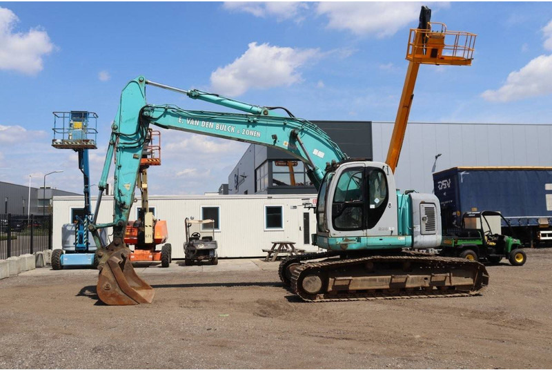 Kobelco SK235SR - Paletli ekskavatör: fotoğraf 1 Kobelco SK235SR - Paletli ekskavatör: fotoğraf 1