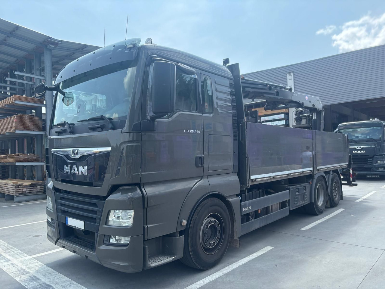 MAN 26.460 TGX Baustoffkran HMF 2110-L3 - Vinçli kamyon: fotoğraf 1 MAN 26.460 TGX Baustoffkran HMF 2110-L3 - Vinçli kamyon: fotoğraf 1